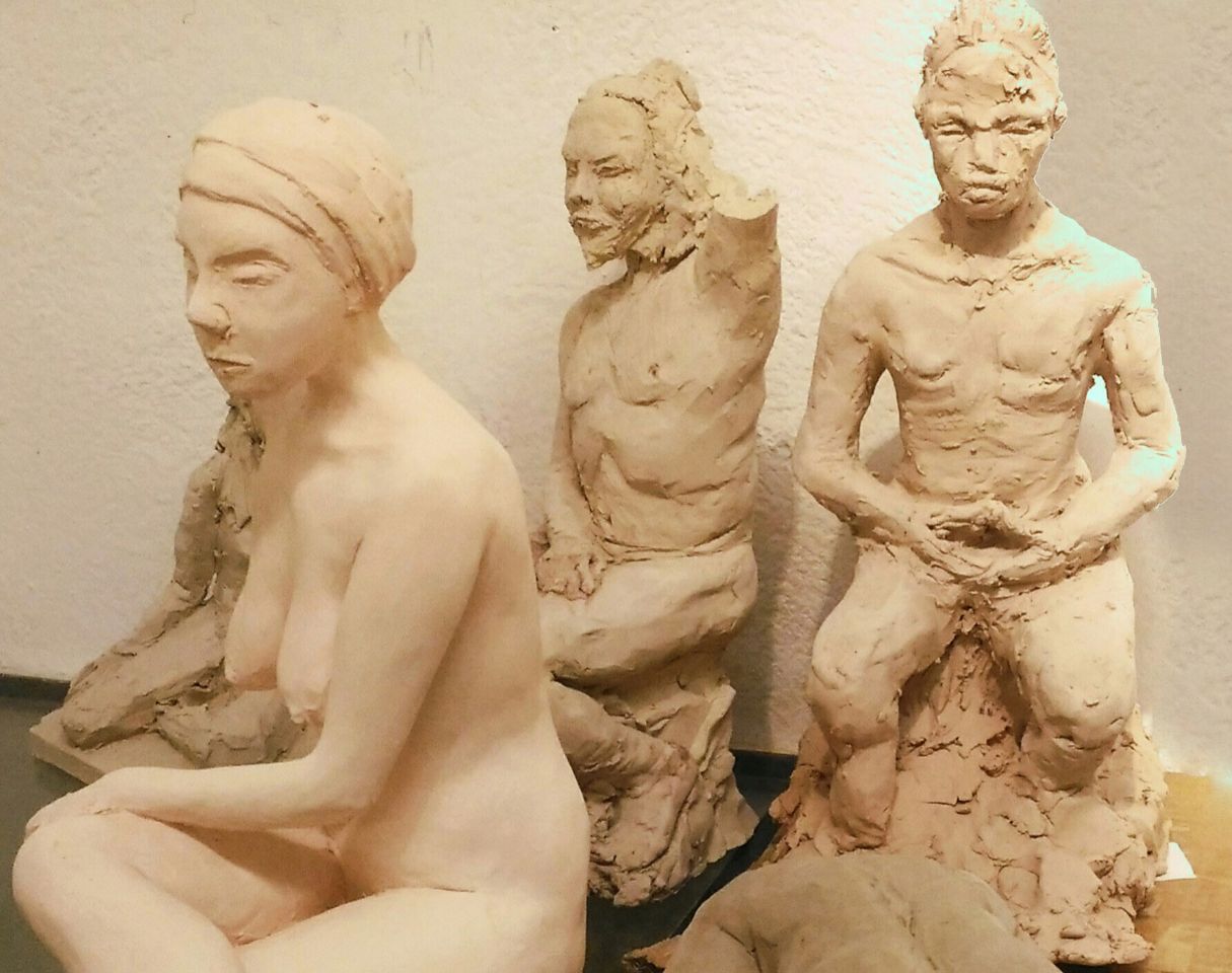 3 sitting figures
